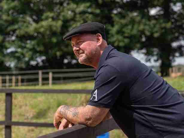 Martin Price overlooking the training paddock at Anmore Dressage